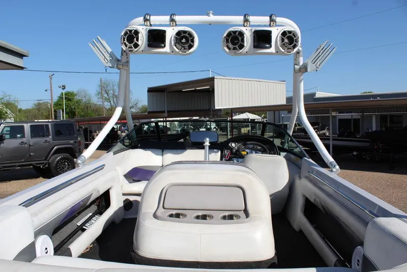 Slide: The Image of 1994 MasterCraft 190 Pro Star boat interior with tower speakers and seating. - 10