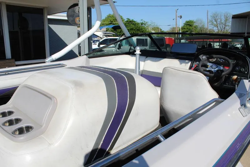 Slide: The Image of 1994 MasterCraft 190 Pro Star boat interior with white and purple seating. - 12