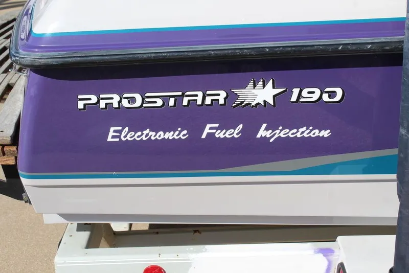 Slide: The Image of 1994 MasterCraft 190 Pro Star with electronic fuel injection, purple and white design. - 16