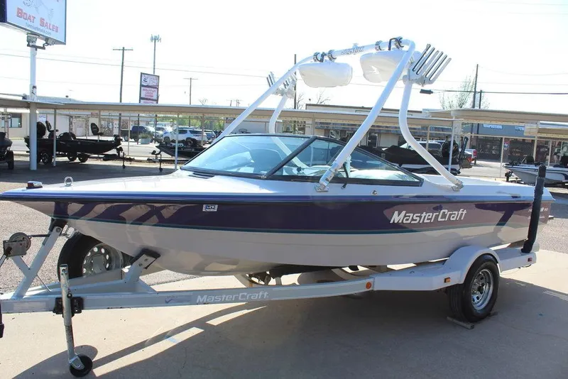 Slide: The Image of 1994 MasterCraft 190 Pro Star boat on trailer, displayed outdoors. - 7
