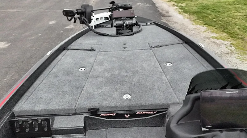 Slide: The Image of 2025 Phoenix 721 ZXL boat deck with advanced navigation equipment and spacious layout. - 17