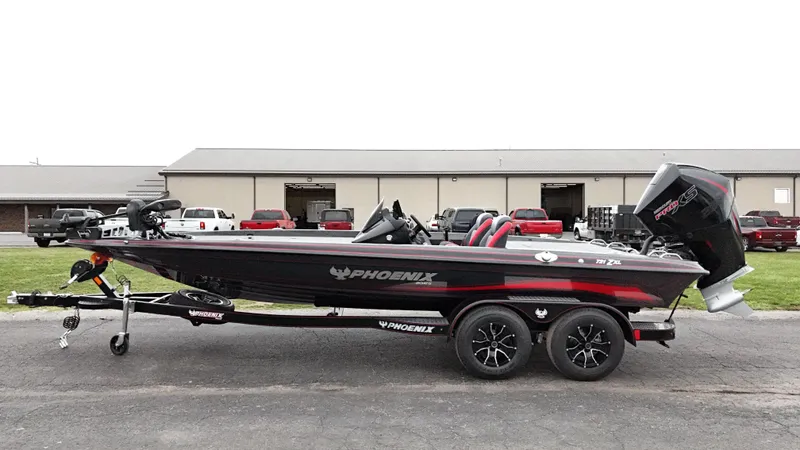 Slide: The Image of 2025 Phoenix 721 ZXL bass boat on trailer, parked outdoors. - 5
