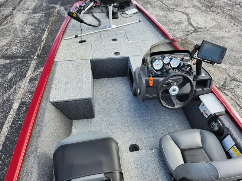 Slide: The Image of 2022 Tracker Pro 170 boat interior with steering console and seating. - 12