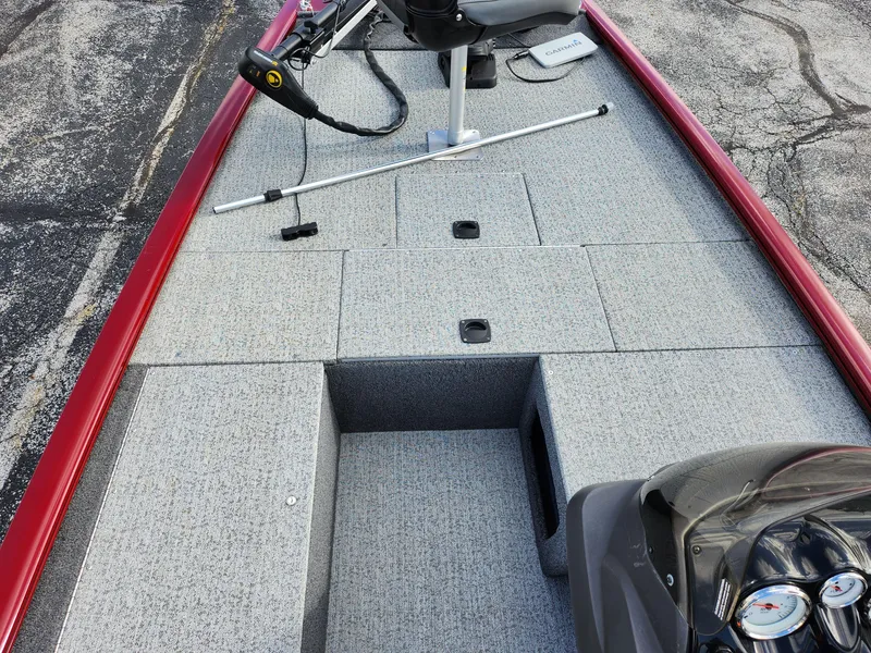 Slide: The Image of 2022 Tracker Pro 170 boat interior with gray deck and red trim. - 15