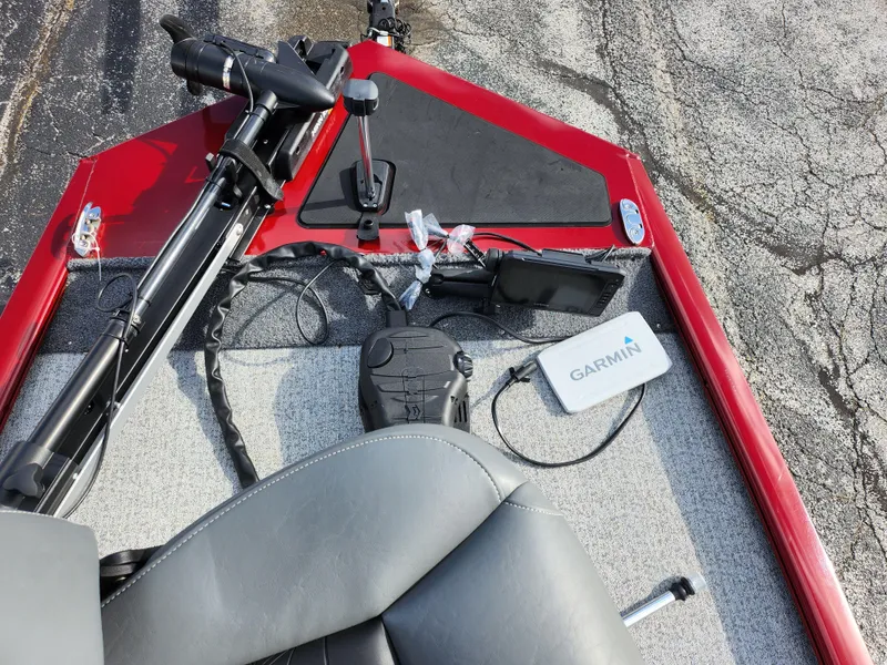 Slide: The Image of 2022 Tracker Pro 170 boat interior with Garmin device and steering controls. - 18