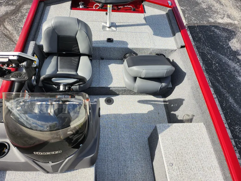 Slide: The Image of 2022 Tracker Pro 170 boat interior with gray seating and red accents. - 21