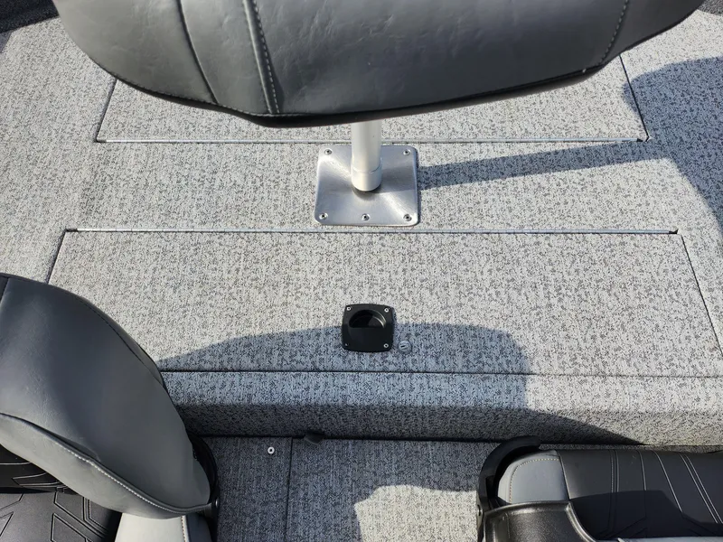 Slide: The Image of 2022 Tracker Pro 170 boat interior with gray seating and carpeted flooring. - 24