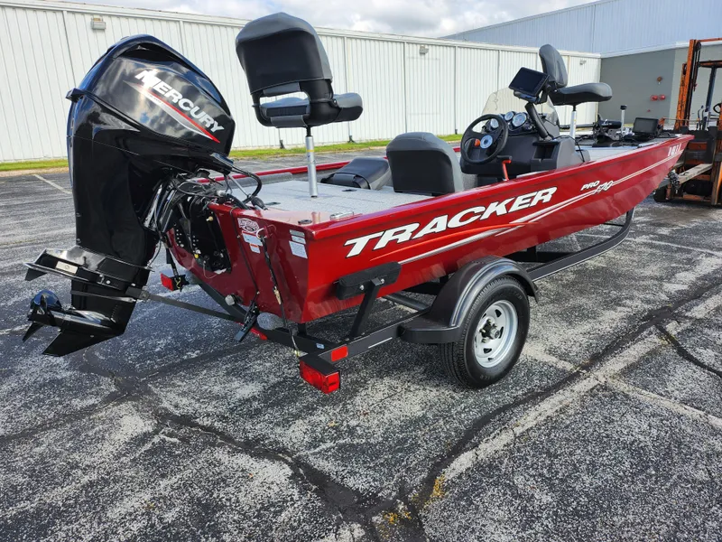Slide: The Image of 2022 Tracker Pro 170 boat with Mercury engine on trailer, parked outdoors. - 3