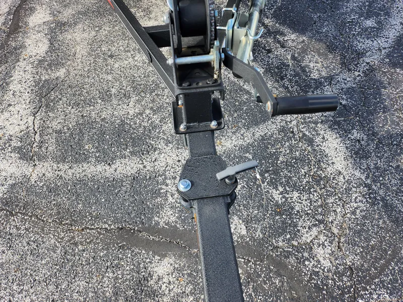 Slide: The Image of Trailer hitch and winch of a 2022 Tracker Pro 170 on asphalt. - 7