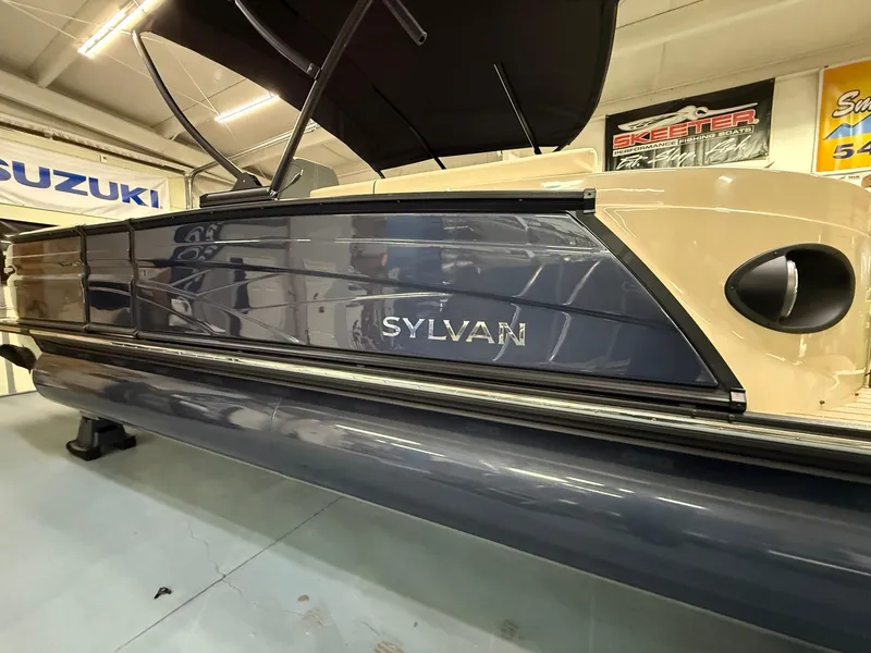 Slide: The Image of 2025 Sylvan G-3 CLZ DH pontoon boat in showroom, side view. - 1