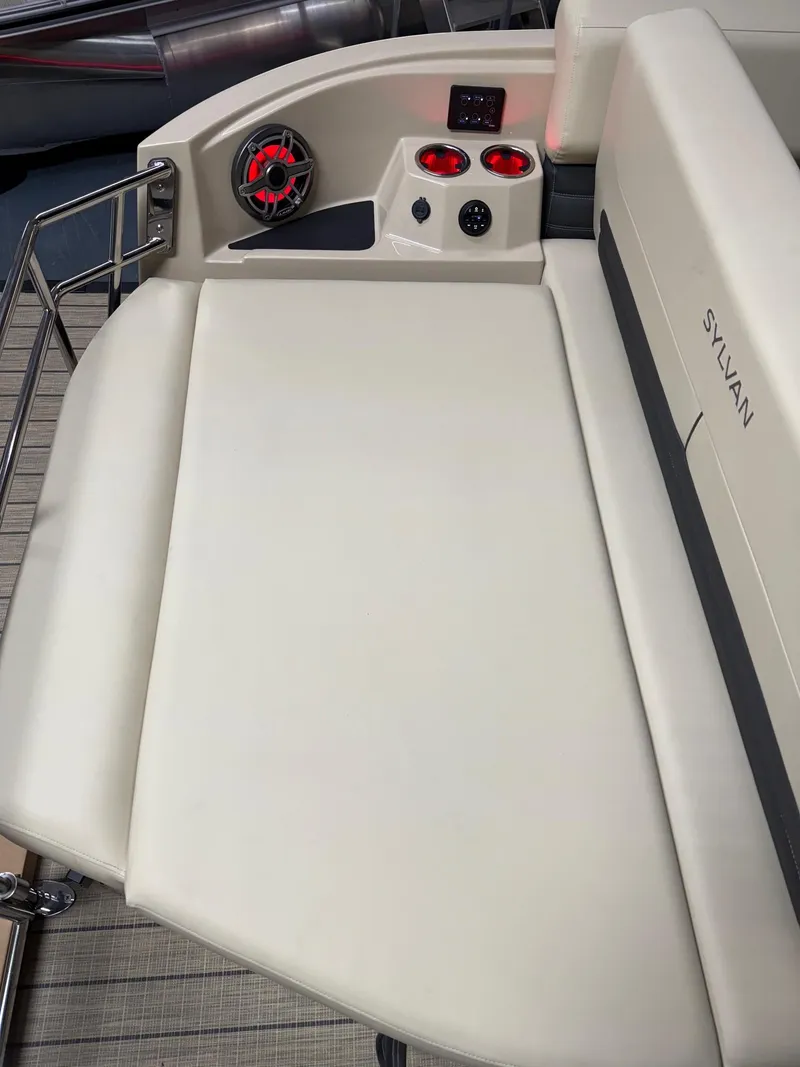 Slide: The Image of 2025 Sylvan G-3 CLZ DH boat interior with beige seating and control panel. - 16