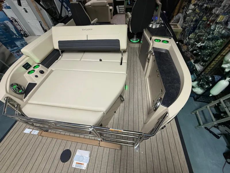 Slide: The Image of 2025 Sylvan G-3 CLZ DH boat interior with beige seating and modern controls. - 17