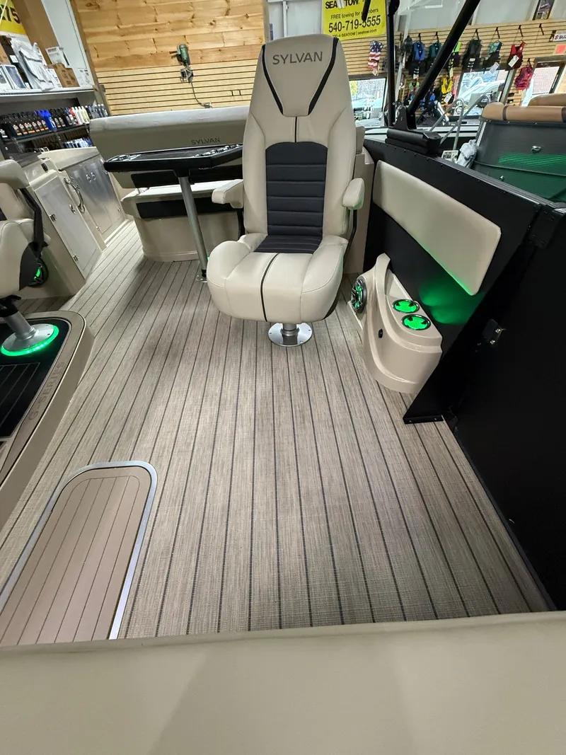 Slide: The Image of 2025 Sylvan G-3 CLZ DH boat interior with modern seating and ambient lighting. - 24