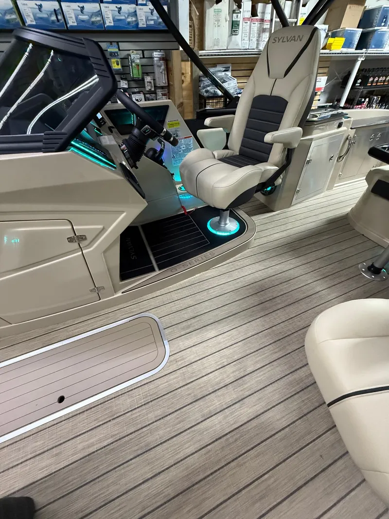 Slide: The Image of 2025 Sylvan G-3 CLZ DH boat interior with modern helm and seating. - 25