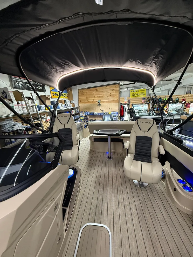 Slide: The Image of 2025 Sylvan G-3 CLZ DH boat interior with beige seating and modern design. - 26