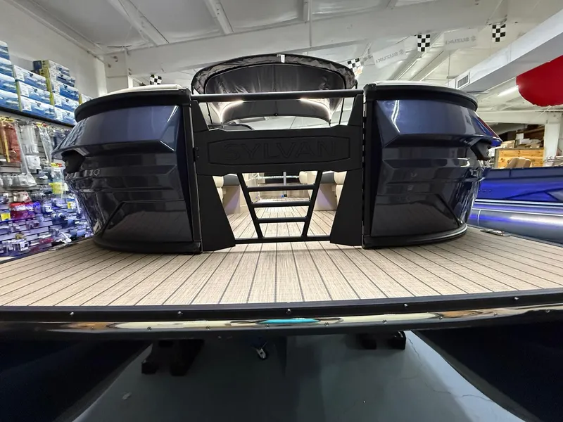 Slide: The Image of 2025 Sylvan G-3 CLZ DH pontoon boat in showroom, showcasing sleek design and spacious deck. - 32