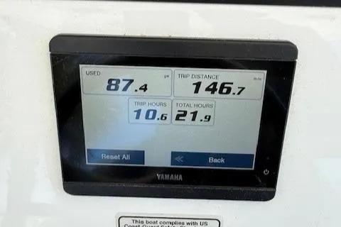 Slide: The Image of Display screen on 2024 Regulator 26XO showing fuel usage and trip data. - 9
