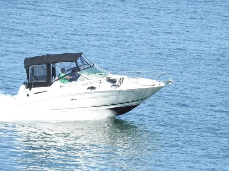 Slide: The Image of 2006 Sea Ray Sundancer cruising on open water, side view. - 0