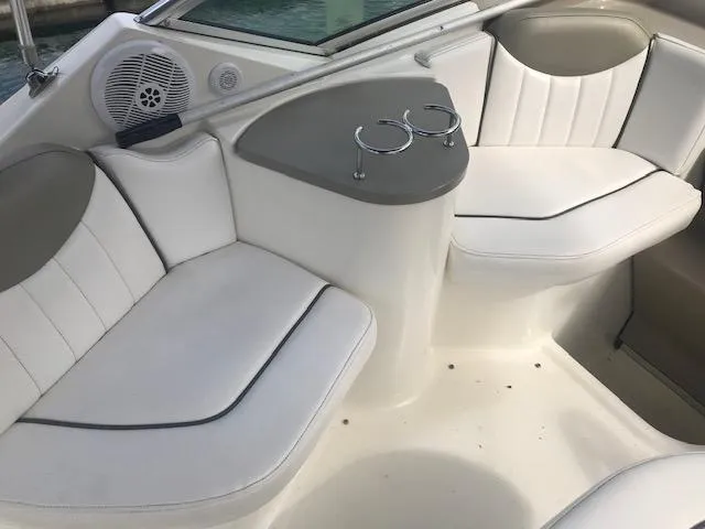 Slide: The Image of 2006 Sea Ray Sundancer interior with white seating and cup holders. - 10