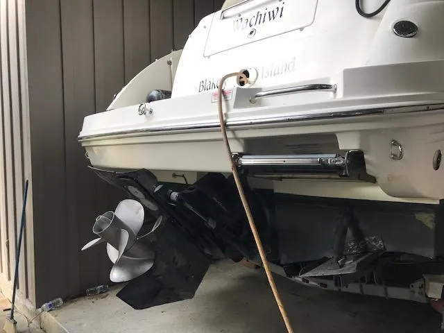 Slide: The Image of 2006 Sea Ray Sundancer boat stern with propeller, docked indoors. - 4