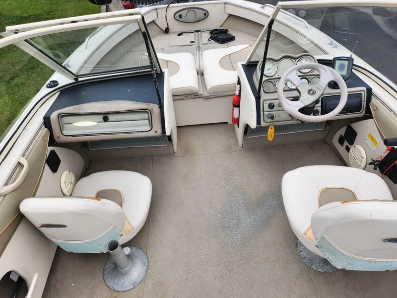 Slide: The Image of Crestliner 1850 Sportfish 2000 boat interior with dual seats and steering console. - 12