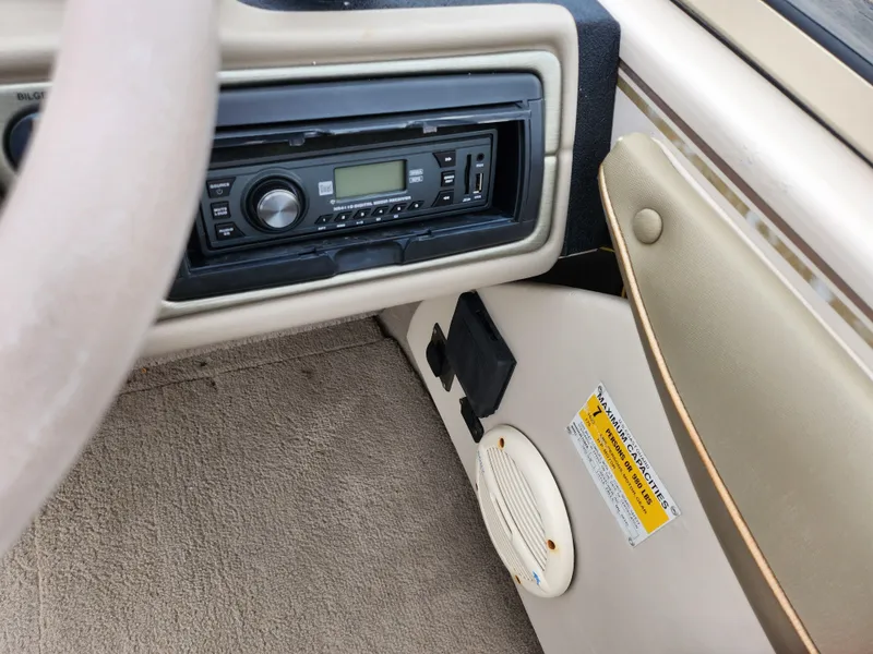 Slide: The Image of Crestliner 1850 Sportfish 2000 dashboard with stereo system and speaker detail. - 14