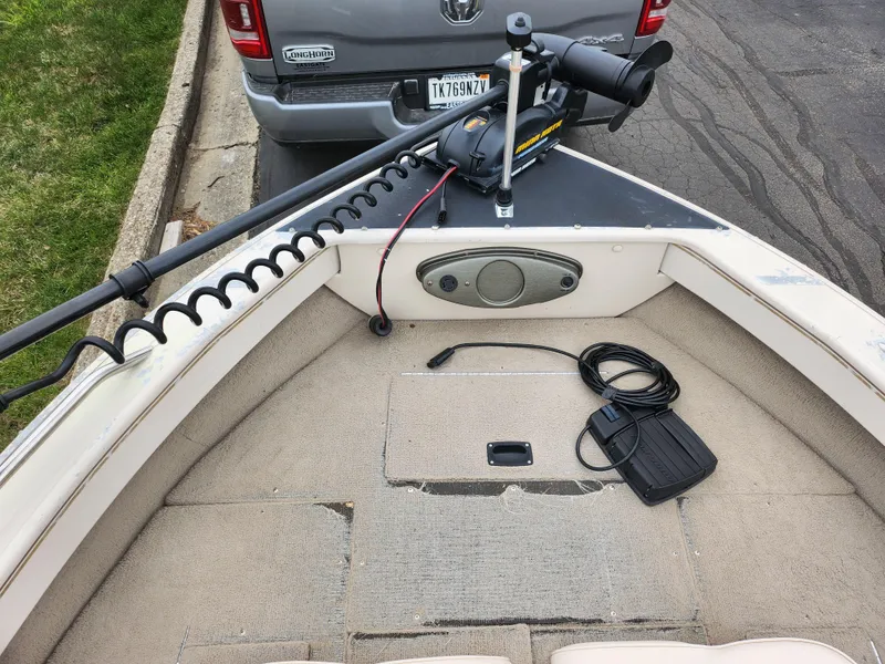 Slide: The Image of Crestliner 1850 Sportfish 2000 boat with trolling motor and control pedal. - 17