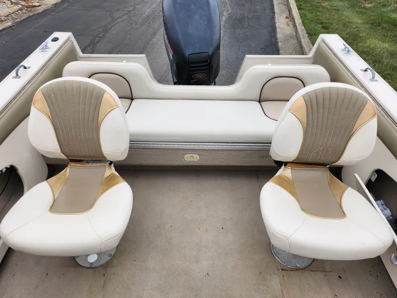 Slide: The Image of Crestliner 1850 Sportfish 2000 boat interior with two swivel seats and rear bench. - 21