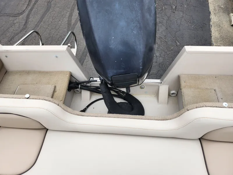 Slide: The Image of Crestliner 1850 Sportfish 2000 boat stern view with motor and seating area. - 22