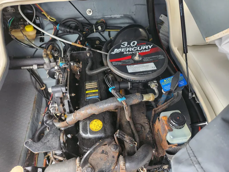 Slide: The Image of Engine compartment of a 2007 Bayliner Discovery 195 with 3.0 Mercury MerCruiser engine. - 21