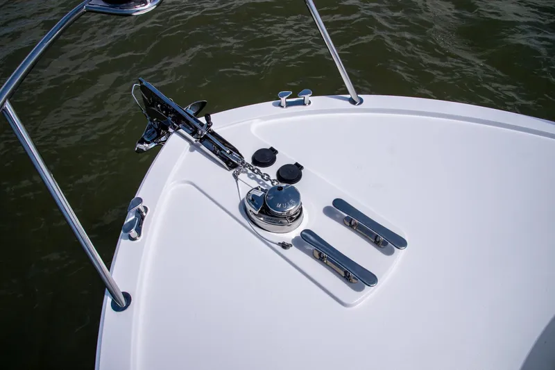 Slide: The Image of Bow of 2025 MJM 35 boat with anchor and cleats on calm water. - 22