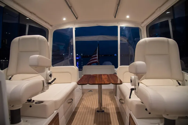 Slide: The Image of Luxurious interior of 2025 MJM 35 yacht with plush seating and wooden table. - 31