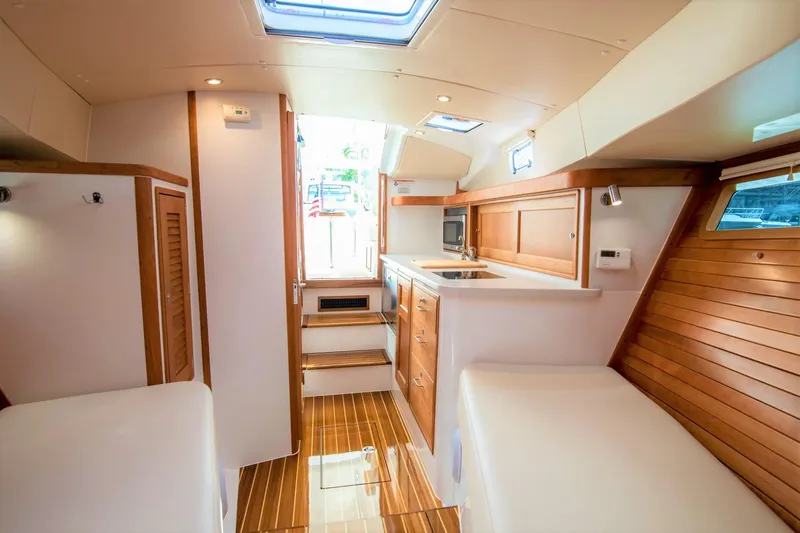 Slide: The Image of Luxurious interior of 2025 MJM 35 yacht with modern kitchen and wooden accents. - 34