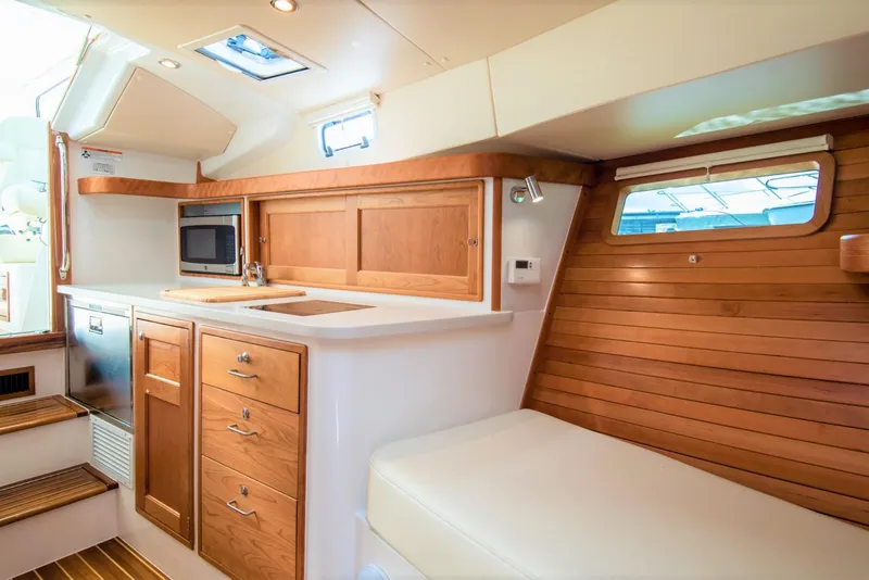 Slide: The Image of Luxurious interior of 2025 MJM 35 yacht with wooden cabinetry and modern amenities. - 36