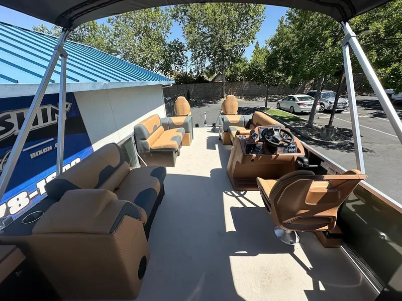 Slide: The Image of 2025 Tahoe Pontoon Geofish RF interior with spacious seating and modern helm. - 18