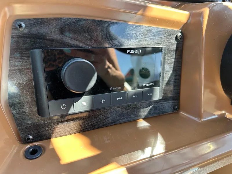 Slide: The Image of 2025 Tahoe Pontoon Geofish RF audio system with Fusion Bluetooth controls. - 21