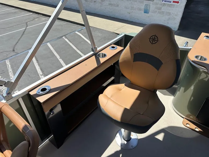 Slide: The Image of 2025 Tahoe Pontoon Geofish RF boat seat and console in sunlight. - 27