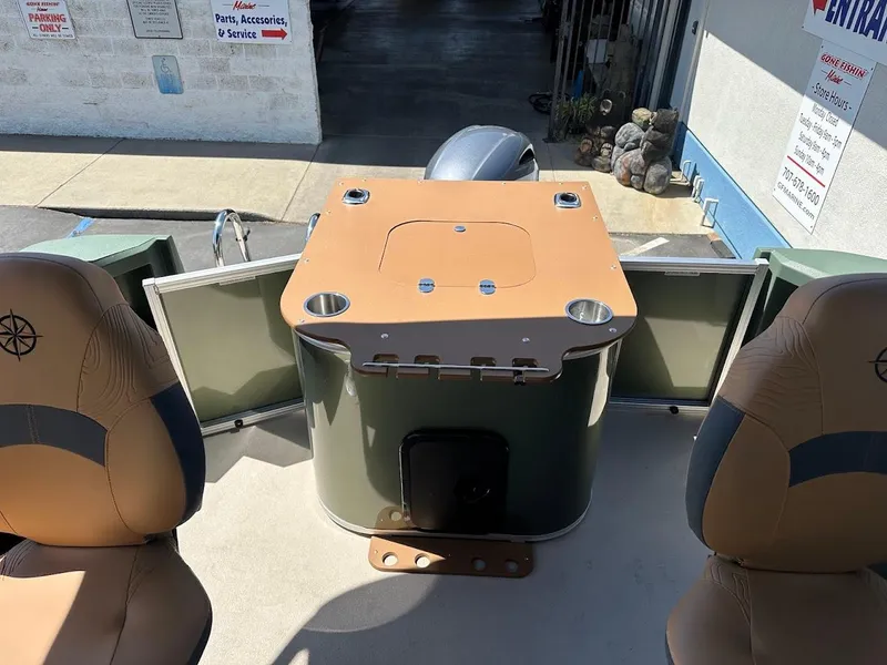 Slide: The Image of 2025 Tahoe Pontoon Geofish RF interior with seating and storage compartments. - 29