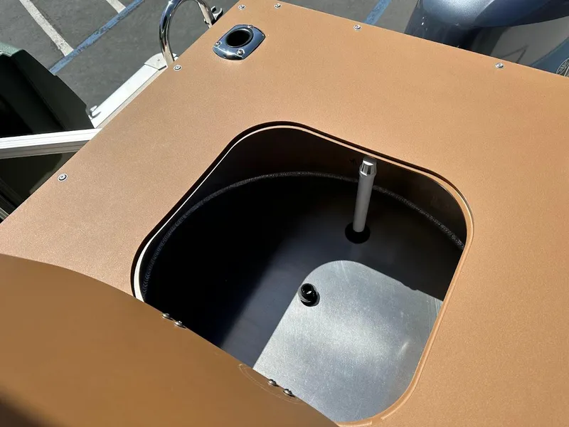 Slide: The Image of 2025 Tahoe Pontoon Geofish RF livewell compartment, open lid, showing interior details. - 31