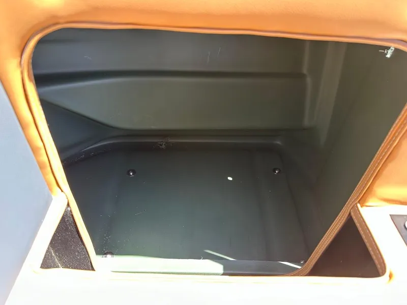 Slide: The Image of Storage compartment of 2025 Tahoe Pontoon Geofish RF boat, open and empty. - 39