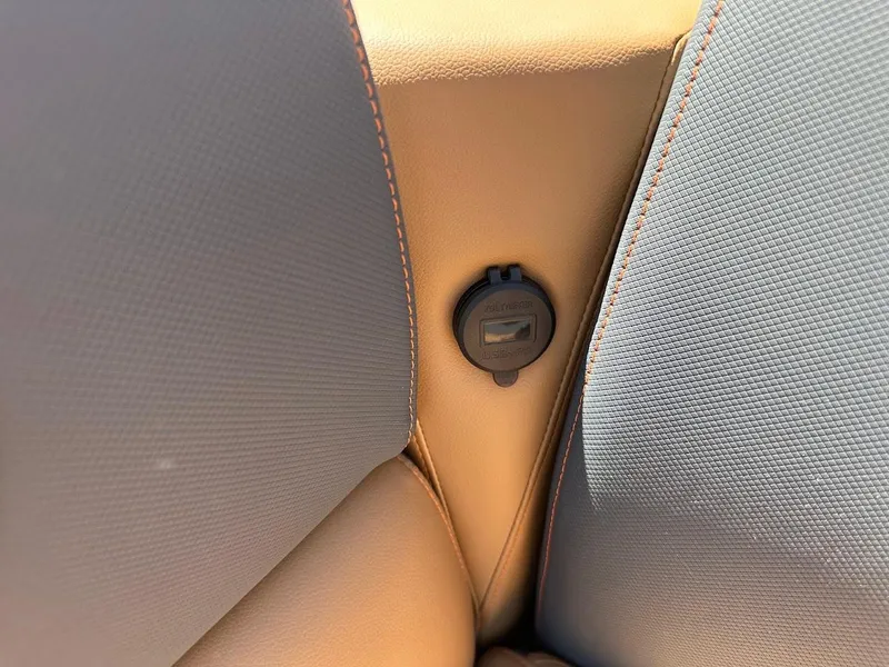 Slide: The Image of 2025 Tahoe Pontoon Geofish RF seat detail with USB port. - 43