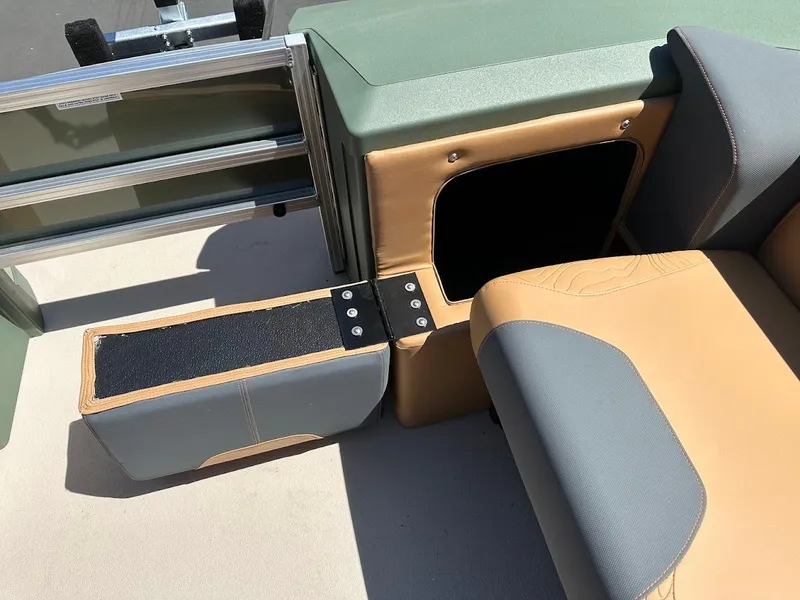 Slide: The Image of 2025 Tahoe Pontoon Geofish RF interior seating and storage compartment detail. - 44