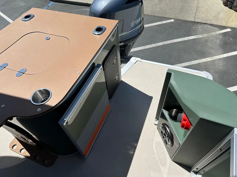 Slide: The Image of 2025 Tahoe Pontoon Geofish RF boat with Yamaha engine, featuring storage compartments. - 47