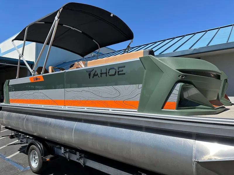 Slide: The Image of 2025 Tahoe Pontoon Geofish RF boat with canopy on a trailer. - 5