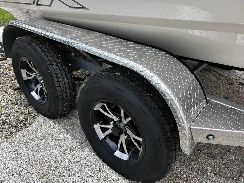 Slide: The Image of 2025 Xpress H210B trailer with dual wheels and diamond plate fender. - 12