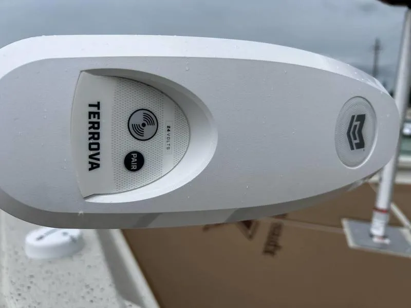 Slide: The Image of Close-up of Terrova motor on 2025 Xpress H210B boat, featuring pairing technology. - 8