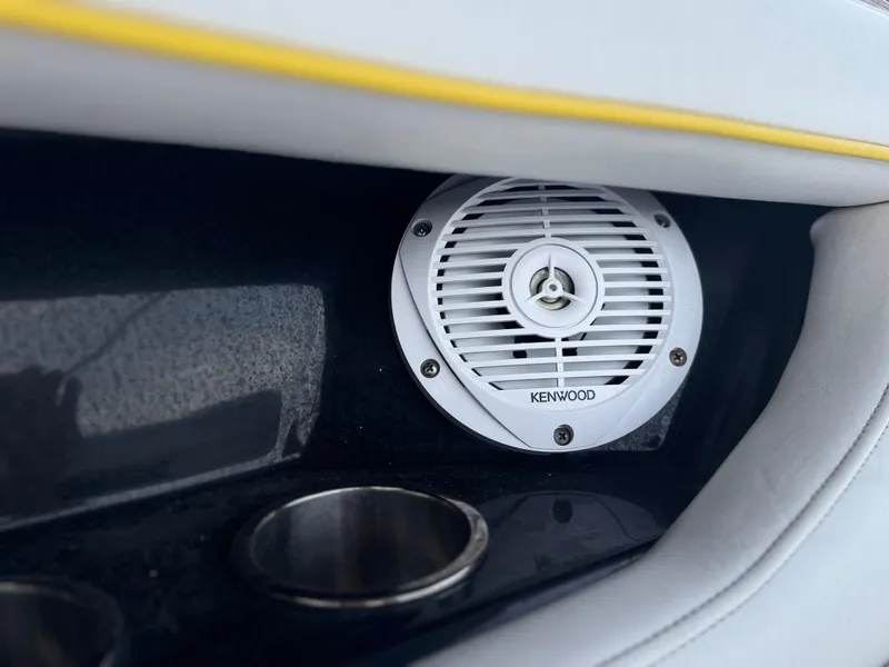 Slide: The Image of Kenwood speaker in 2008 Regal 2520 FasDeck boat interior with cup holder. - 13