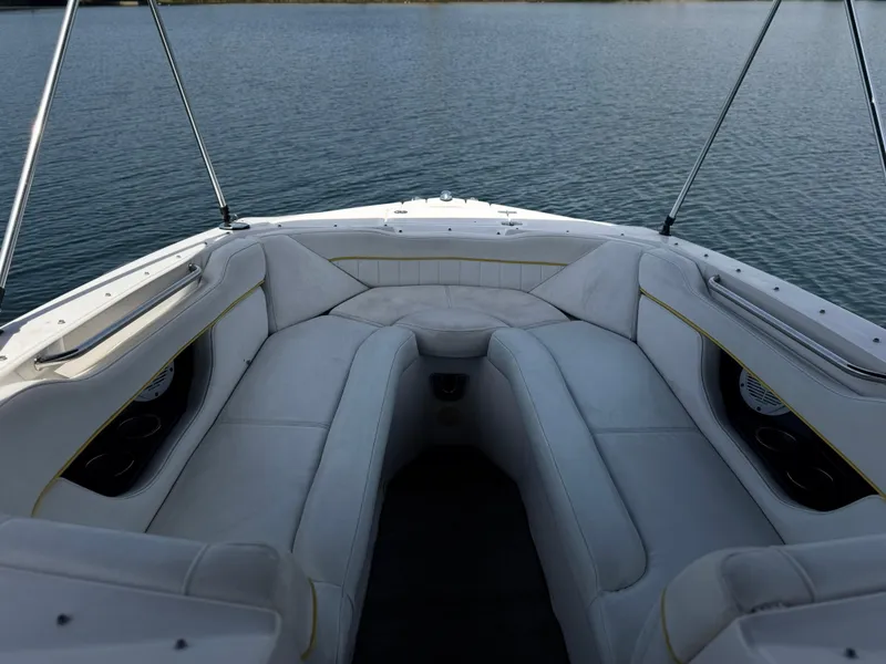 Slide: The Image of Bow seating area of 2008 Regal 2520 FasDeck boat on calm water. - 16