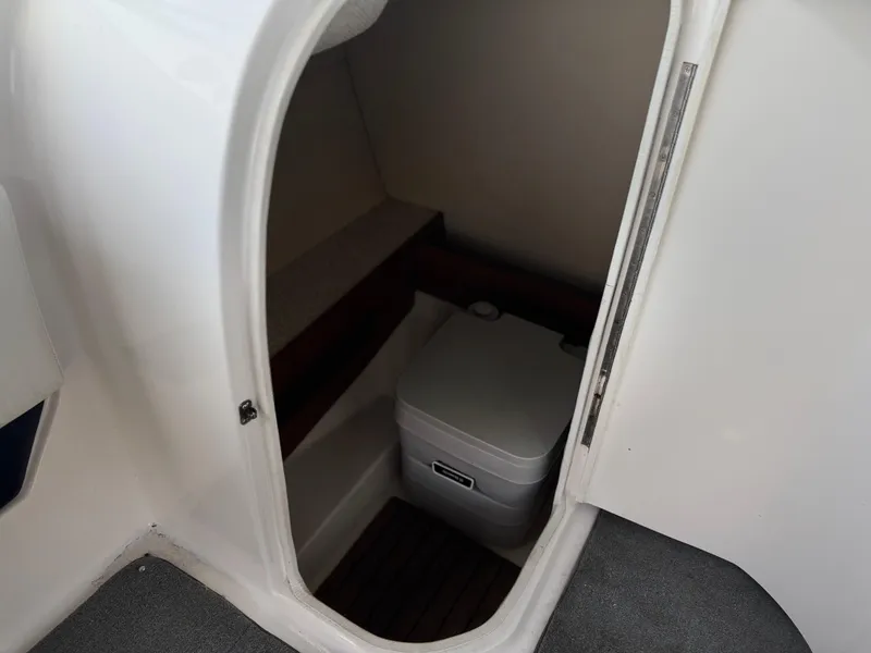 Slide: The Image of 2008 Regal 2520 FasDeck boat interior with compact toilet compartment. - 8
