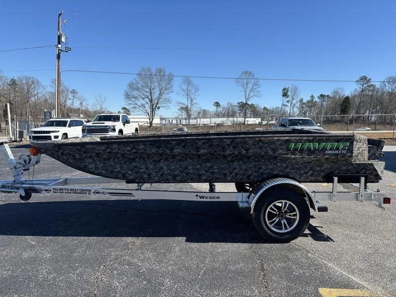 The Image of 2025 Havoc 1656 VJST boat on trailer, parked in outdoor lot. - 1